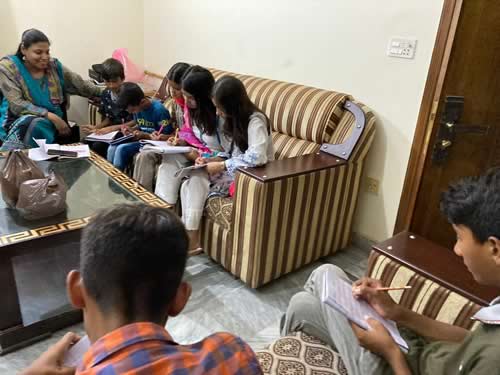 Volunteer Wardah instructing Little lingusits of Lahore