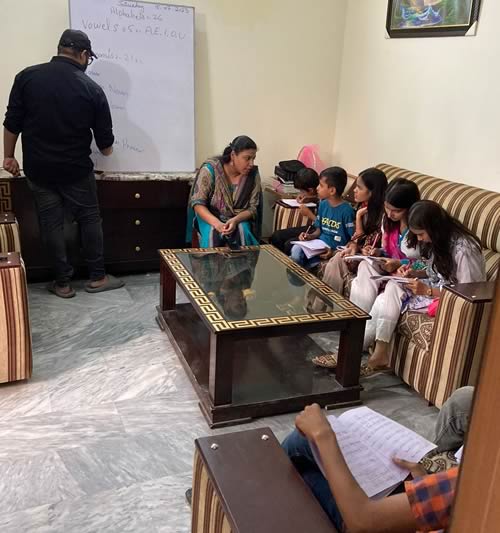 Volunteer Instructors Nabeel and Wardah with Little lingusits of Lahore
